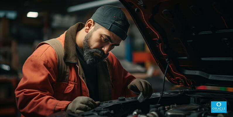 A mechanic performing a vehicle safety inspection in California