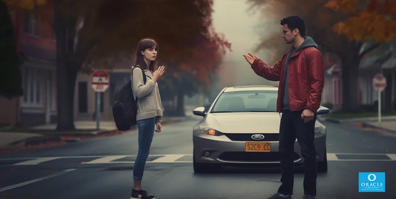 A pedestrian and a motorist standing on a street with traffic lights in the background