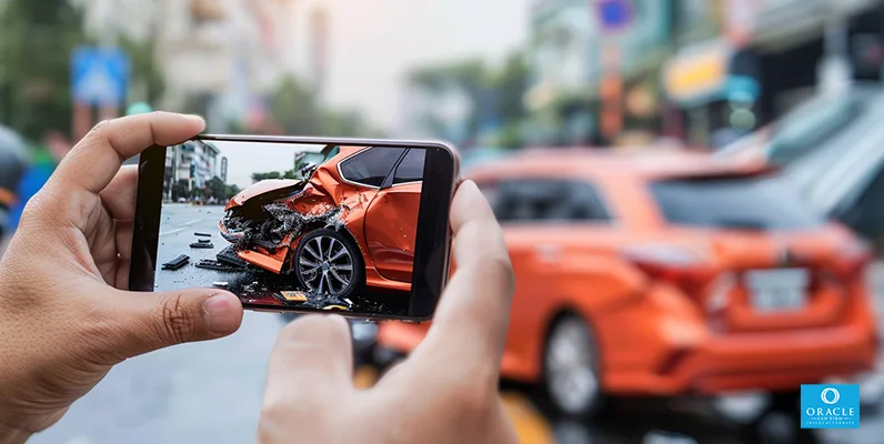 A photograph of a person posting about their car accident on social media, with warning signs.