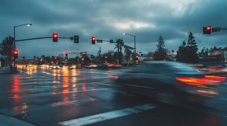 A car crossing a busy intersection in Anaheim, violating the red-light