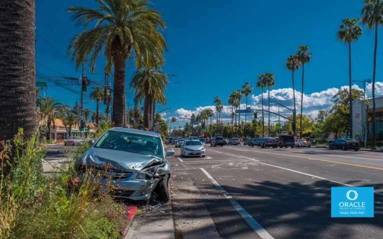 A urban street scene in Anaheim near Harbor Boulevard, showing a recent minor car accident with vehicles stopped safely on the roadside. Subtle Anaheim landmarks and palm-lined streets in the background.