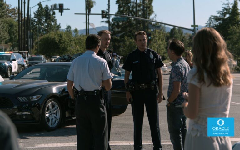 Photorealistic car accident at a busy California intersection, independent witnesses speaking with police officers while injured parties receive assistance, realistic traffic conditions, documentary-style photography, cinematic lighting, ultra-detailed