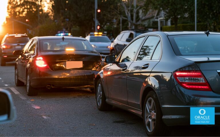 Two cars with minor rear-end fender-bender damage pulled over on a California suburban street, daylight, hazard lights on. No graphic injuries, no faces clearly visible. Represents the low-damage, potentially high-injury scenario at the core of the post.