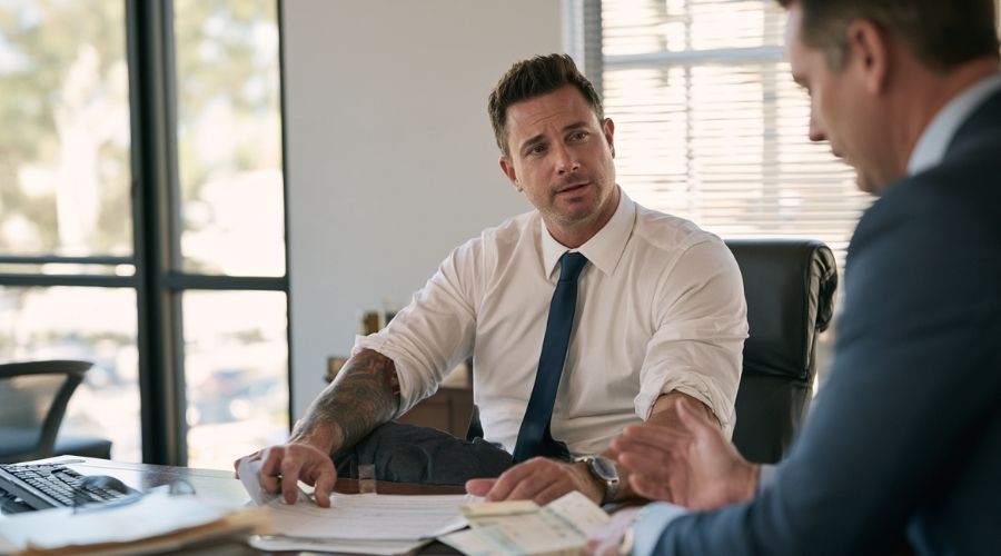 Stipulations vs. Compromise and Release: Which Settlement? 2 Injured worker reviewing a lump-sum workers' compensation settlement with an attorney